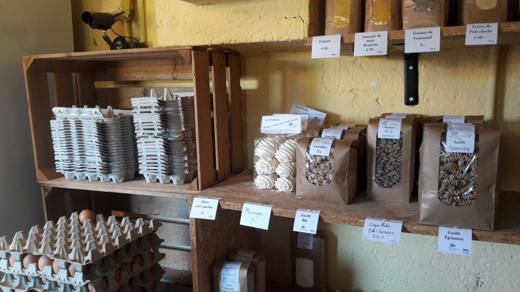 Eggs, pasta, grains are sold in the shop.